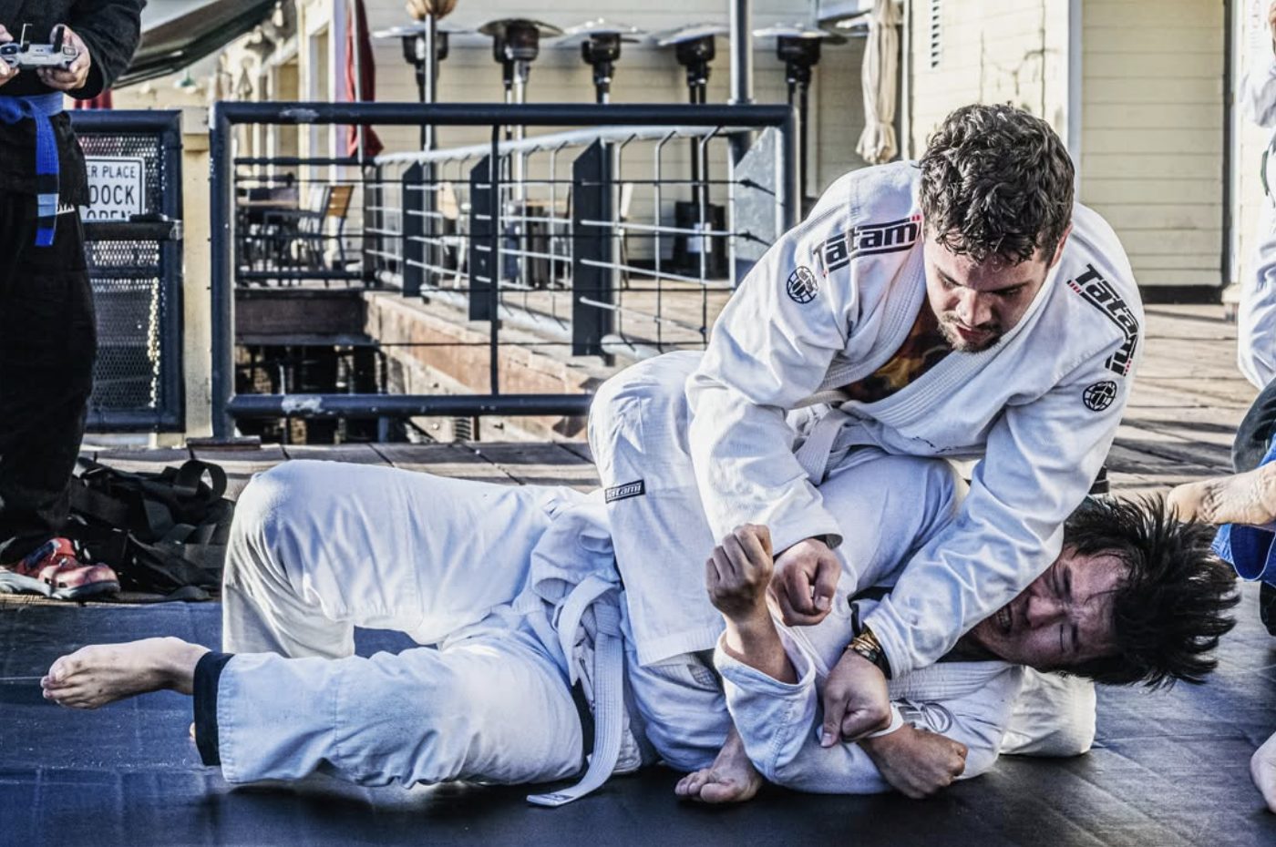 White belts rolling on the boardwalk